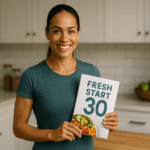 Confident person holding Fresh Start 30 meal plan showing 17 day habit formation breakthrough in bright modern kitchen